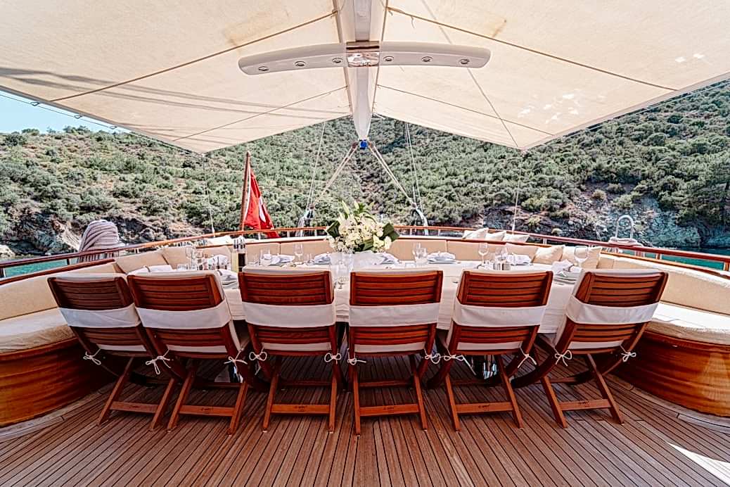 Outdoor dining and meals served on a gulet deck
